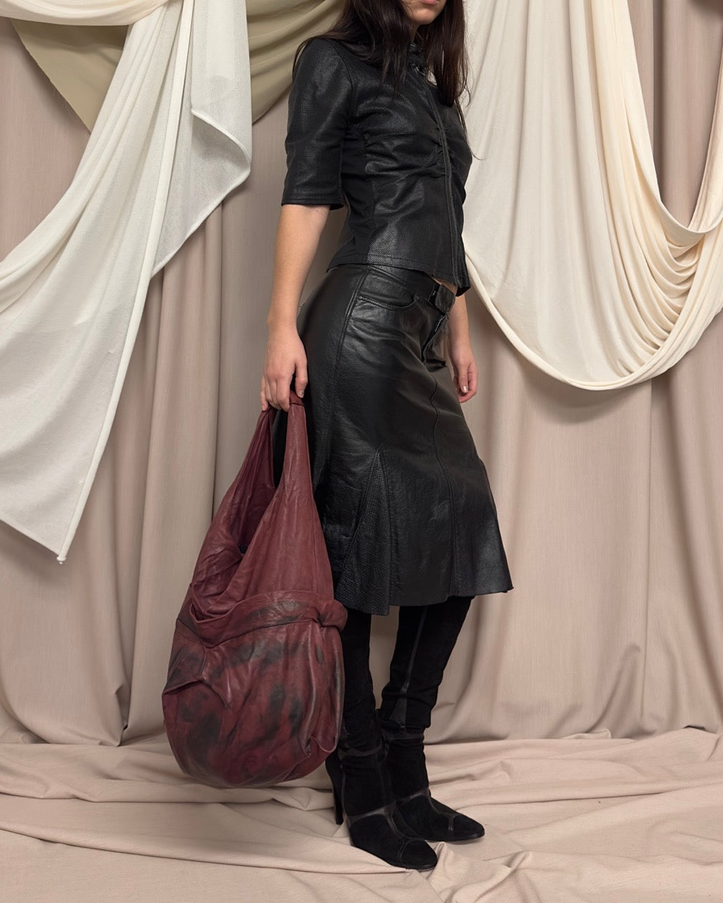 BLACK SHORT SLEEVE PERFORATED LEATHER JACKET by Nolita