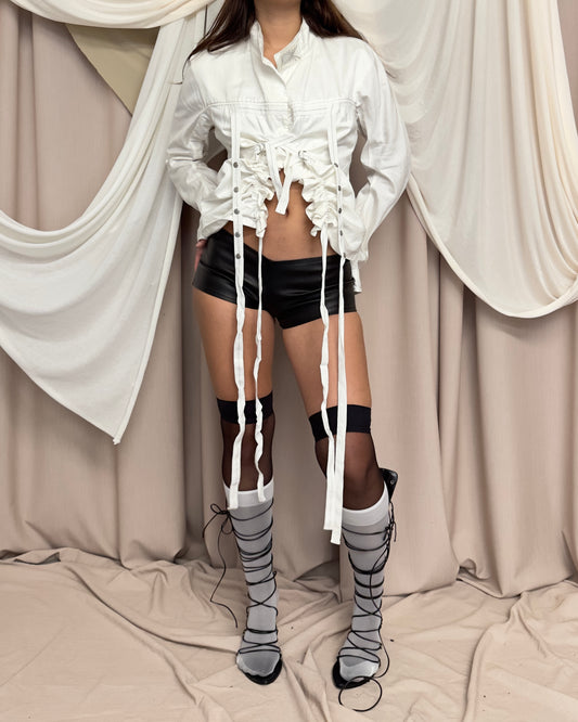 WHITE SHIRT WITH ASYMMETRICAL HEM AND UTILITARIAN STRAPS by Marithé + François Girbaud