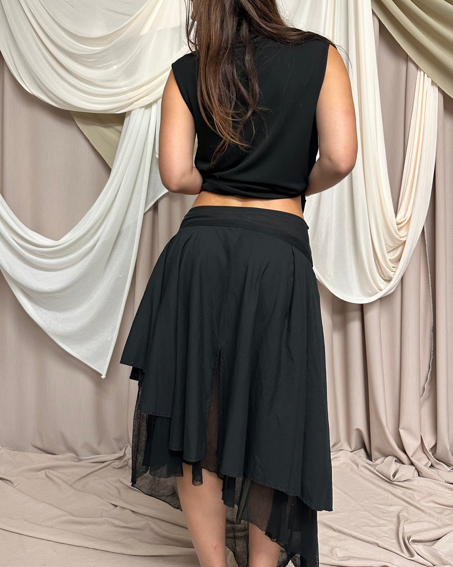LAYERED BI-MATERIAL MIDI SKIRT WITH ASYMMETRICAL HEMS by Hybris