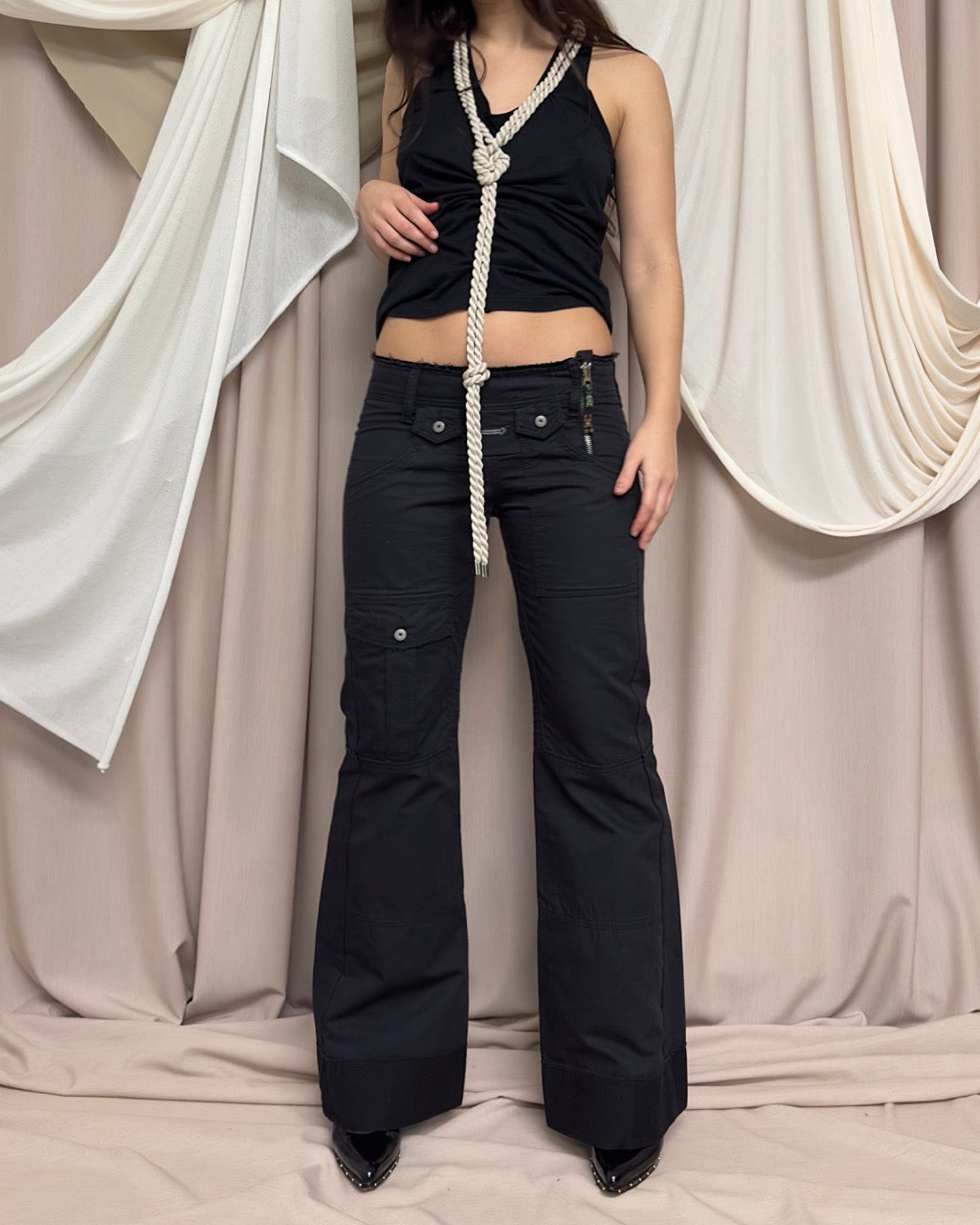 BLACK JEANS WITH ASYMMETRIC ZIP CLOSURE by Marithé + François Girbaud