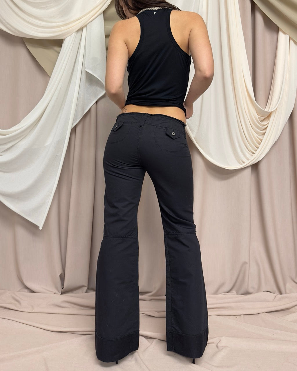 BLACK JEANS WITH ASYMMETRIC ZIP CLOSURE by Marithé + François Girbaud