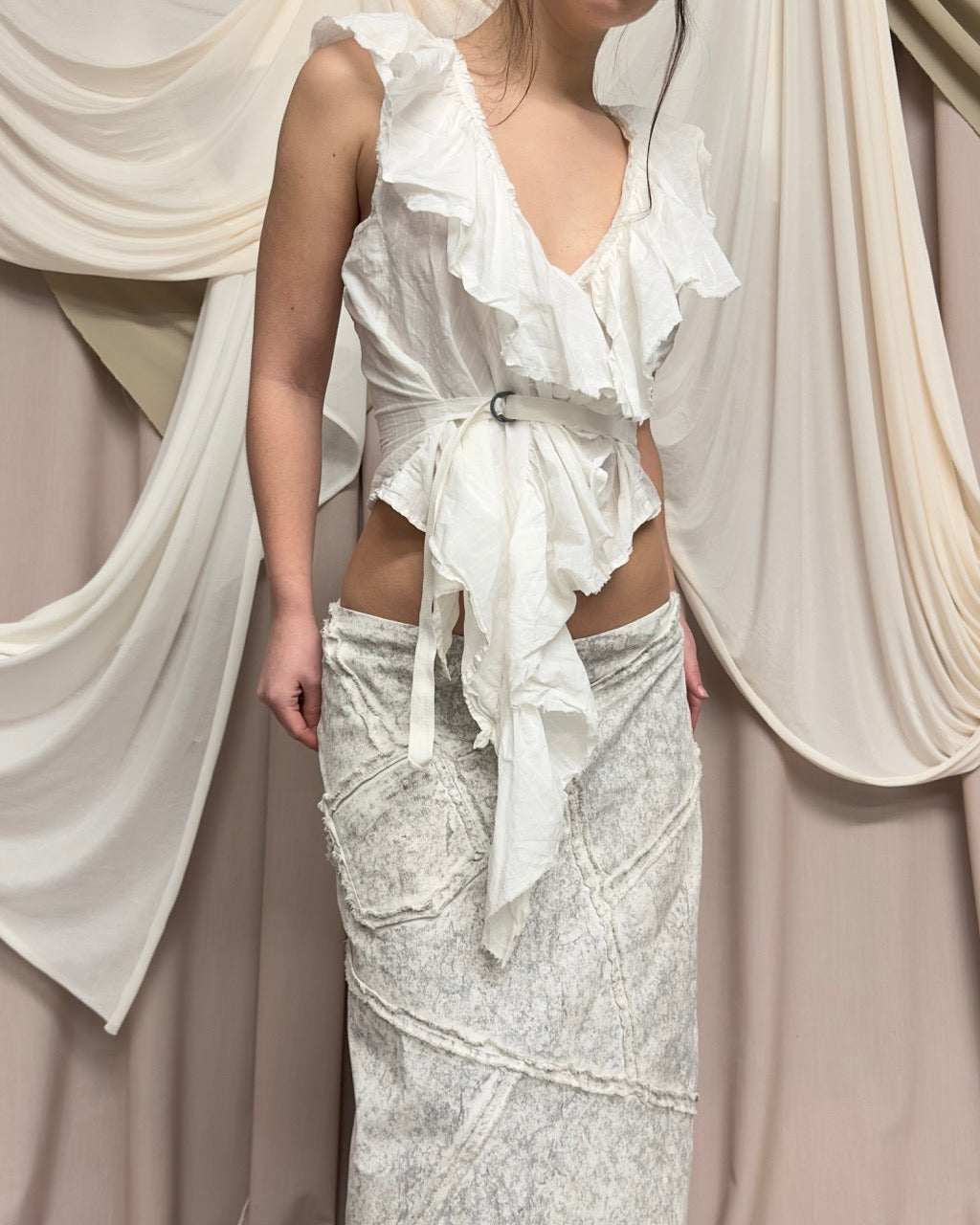 WHITE VEST WITH DISTRESSED RUFFLED PANEL